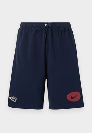 Shorts de sport bleu marine avec taille élastique et cordon de serrage, avec le texte "athletic dept." sur la jambe gauche et le logo Nike swoosh rouge sur la jambe droite.