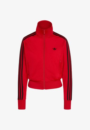 Red zip-up track jacket made of smooth material, featuring a high collar, two side pockets, and black stripes along the sleeves.