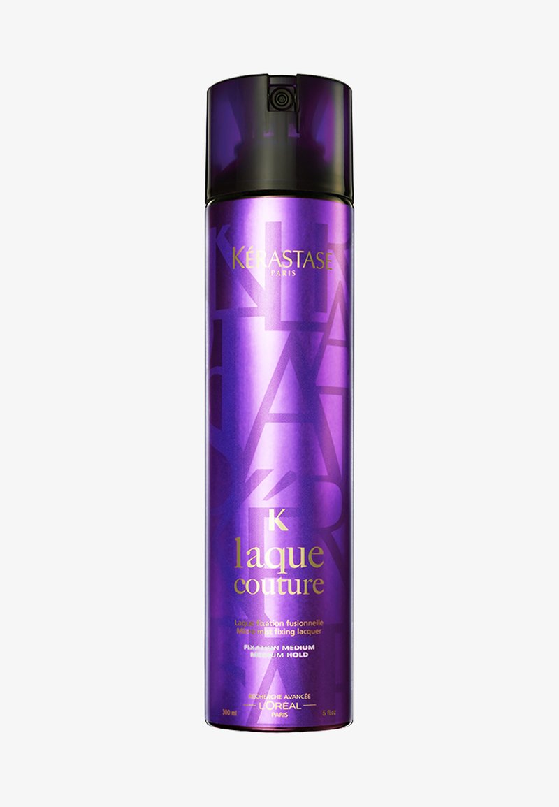Lilas sprayboks med glanset finish, med gulltekst "K laque couture" og geometriske mønstre. Inneholder 300 ml middels sterk lakk.