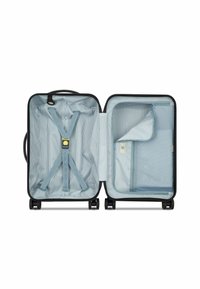Black hard-shell suitcase opened to reveal a light blue striped interior, featuring adjustable straps and a zippered compartment.