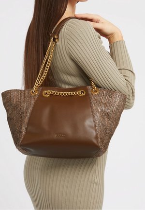 Brown leather tote bag with woven accents, gold chain handles, and a logo detail. Spacious design, featuring a structured top and soft texture.
