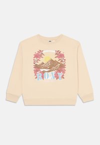 Felpa beige con grafica di una montagna e un sole, circondata da fiori rosa. Logo "ROXY" in blu sotto il design. Vestibilità classica, maniche lunghe.