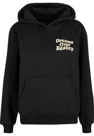 Sudadera negra hecha de tela suave, con un bolsillo frontal y capucha con cordón. El texto en el pecho dice "Los sueños sobre la realidad" en color crema.