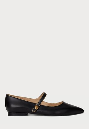 Black leather Mary Jane flat with pointed toe, gold trim, and gold decorative button on strap against plain white background.