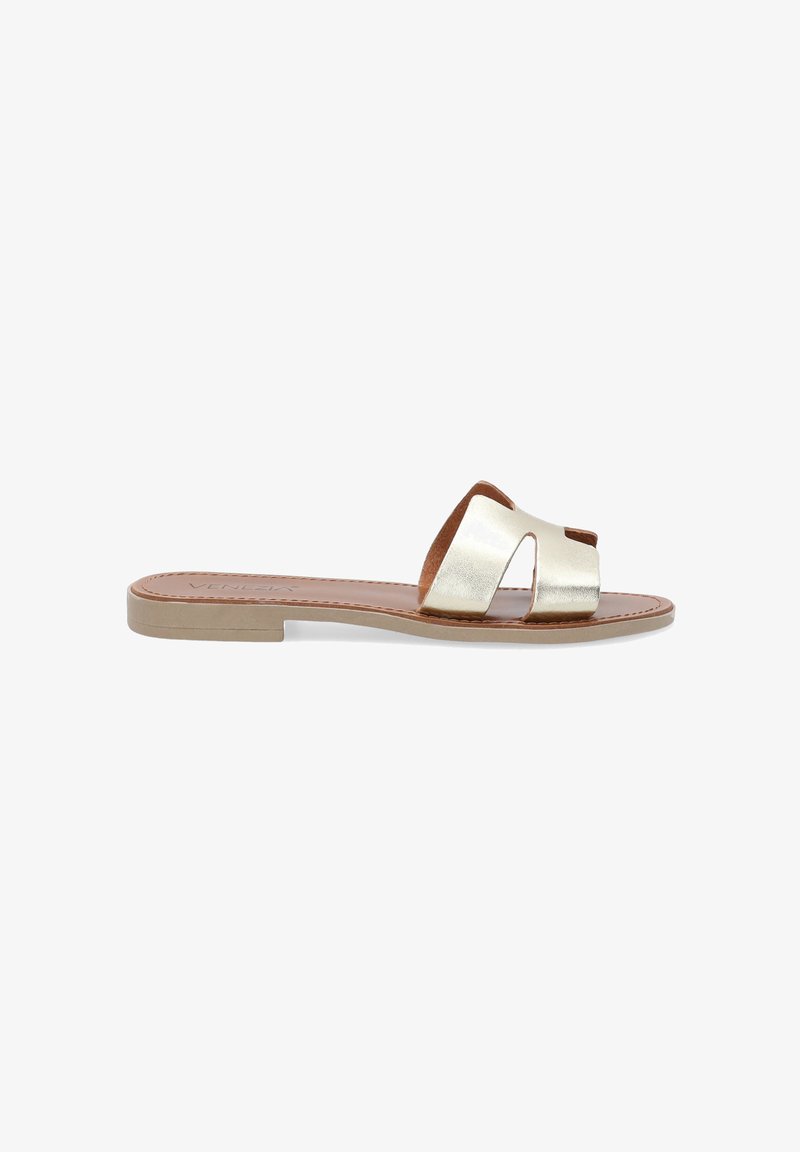 Gold leather slide sandal with a cut-out design, flat brown sole, and tan insole. Features a smooth metallic finish and no embellishments.
