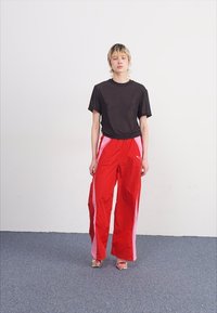 Puma DARE TO PARACHUTE PANTS - Hlače - for all time red