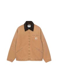Giacca in cotone beige con colletto in velluto a coste marrone scuro, chiusura frontale con zip, due tasche laterali e una tasca sul petto con zip.