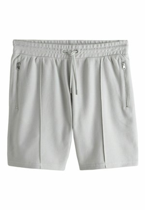 Light gray textured athletic shorts with elastic waistband, drawstring, and vertical zippered pockets on both sides.