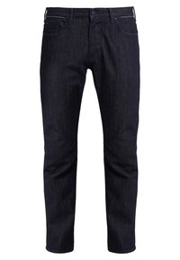 Jean en denim foncé à coupe droite, doté d'un design à cinq poches, de légères marques d'usure et de coutures contrastantes le long de la ceinture.