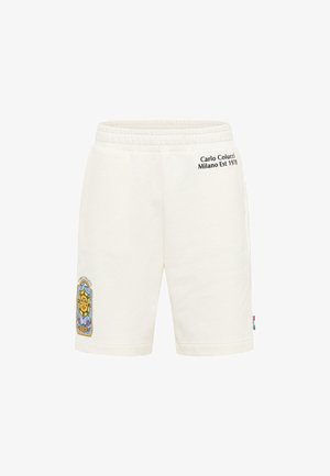 White cotton shorts with an elastic waistband, featuring a colorful graphic emblem on the left leg and text in black on the back.