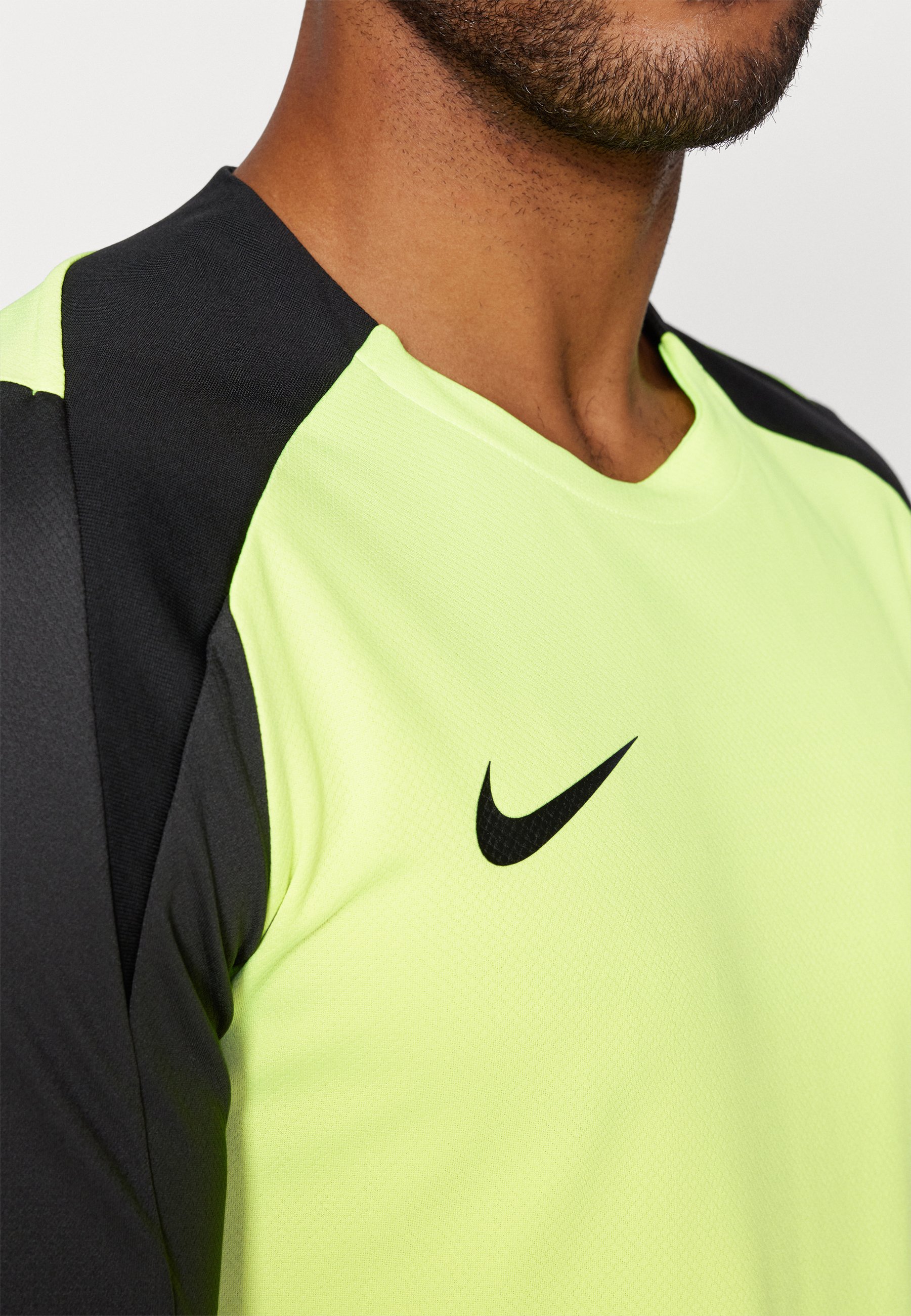 black and volt nike shirt
