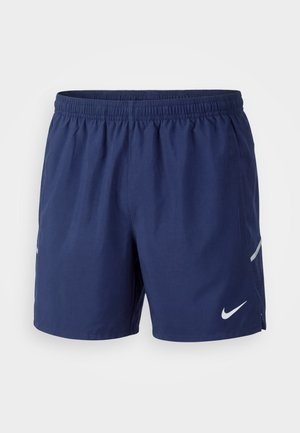 Shorts de sport bleu marine pour hommes avec taille élastique et logo Nike blanc sur la jambe gauche, présenté sur fond uni.