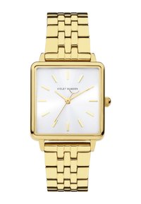 Gouden rechthoekig horloge met een zilveren zonburst wijzerplaat, gouden uurmarkeringen en een metalen armband met een patroon in de schakels.