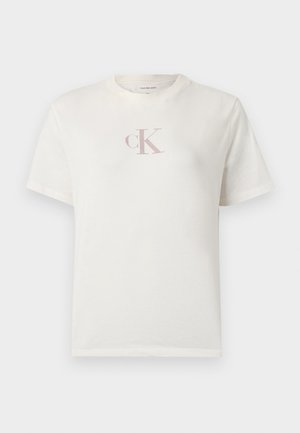 Trumpomis rankovėmis balti medvilniniai marškinėliai, ant krūtinės nedidelis šviesiai rožinis „CK“ logotipas ir klasikiniu apvaliu kaklu. Minkšta tekstūra.