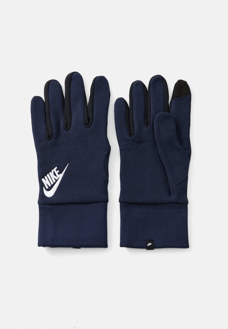 Tumšzilganas cimdi ar rievotu aproti, ar balto Nike logotipu. Pirkstu gali ir melni, lai nodrošinātu saskarsmes saderību.