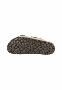 Die Außensohle der Schuhe ist mit einem strukturierten braunen Gummi-Design mit kreisförmigen Mustern ausgestattet, die Grip und Langlebigkeit für den täglichen Gebrauch bieten.