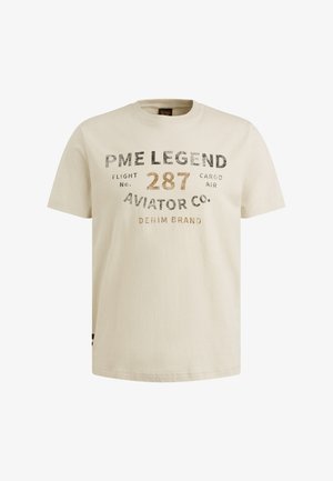 Lys beige bomulds T-shirt med korte ærmer, der har sorte og gyldne grafiske tekstelementer på fronten, rund halsudskæring og lige kant.