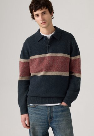 Navy knit pullover with a collar, featuring horizontal stripes in red and beige. Textured fabric, ribbed cuffs, and hem detail.