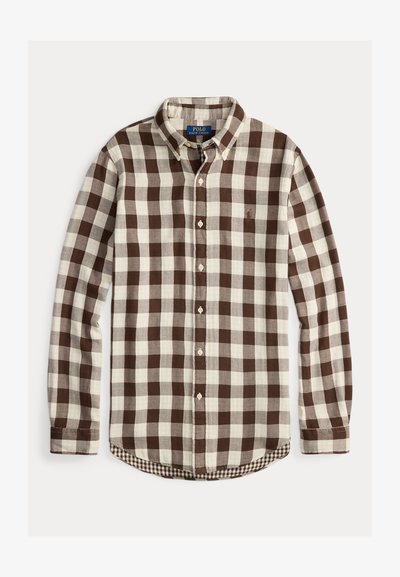 Rjava in smetanasta karo srajca z gumbki, ovratnikom, dolgimi rokavi in majhnim logotipom "Polo" na prsih. Teksturna tkanina.