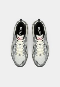 Pair of gray, white, and black Mizuno running shoes with white laces, viewed from above on a plain white background.