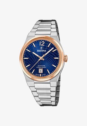 Festina-Uhr mit blauem, gemustertem Zifferblatt, Roségolddetails, silberner Edelstahlarmband und einem Datumsfenster auf 6 Uhr. 10 bar wasserdicht.