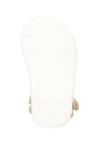 Tas sel sandal datar, bahan karet putih dengan pola cengkeraman yang tekstur, dilengkapi ujung bulat dan tali strap lembut berwarna beige.