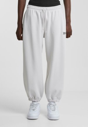 LOGO - Tracksuit bottoms - grey beige