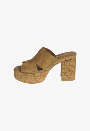 Brown suede platform sandals with an open toe design, featuring a cork-textured heel and base, and a smooth interior lining.