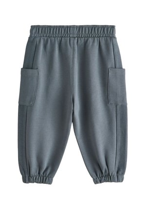 Szürke melegítőnadrág gumis derékrésszel, oldalzsebekkel és texturált oldalsó panelekkel, bokán összegyűrt mandzsettákkal.