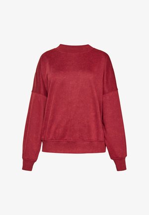 Punainen collegepaita, joka on valmistettu pehmeästä materiaalista. Siinä on pyöreä kaulus, pudotetut olkapäät ja ribatut hihansuut, ja se on rentoa mallia.