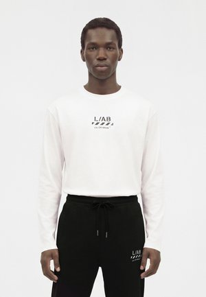 L/AB c/o Off-White, DIAG OPEN HEM PANTS - Долнище на анцуг - black