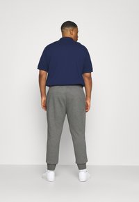 Lacoste Treniņtērpa apakšdaļas - pitch chine