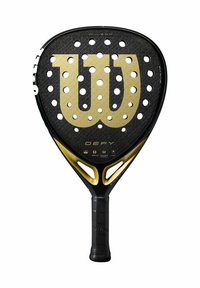 Wilson padelrack med en svart strukturerad yta, guldlogotyp, cirkulära perforeringar och ett svart gummigrepp på skaftet.