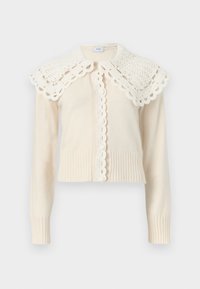 Κρεμ πλεκτή ζακέτα με μακριά μανίκια, με κυματιστά τελειώματα και φαρδιά, κροσέ δαντέλα στο γιακά.