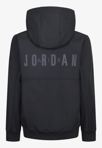 Sweatshirt à capuche noir avec un grand texte "JORDAN" en gris foncé contrastant, en matériau doux, avec des poignets côtelés et une finition lisse.