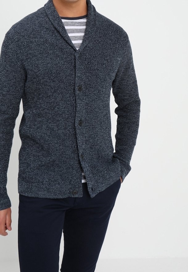 Dark blue knit cardigan with a shawl collar, featuring a textured pattern and two front buttons, worn over a striped shirt.