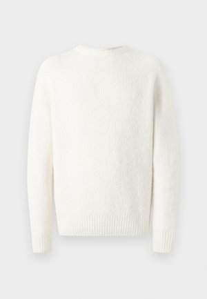 Valkoinen neulepaita, jossa on teksturoitu kuosi, pyöreä kaula-aukko ja pitkät raglanhihat. Paita on valmistettu pehmeästä ja mukavasta kankaan pinnasta.