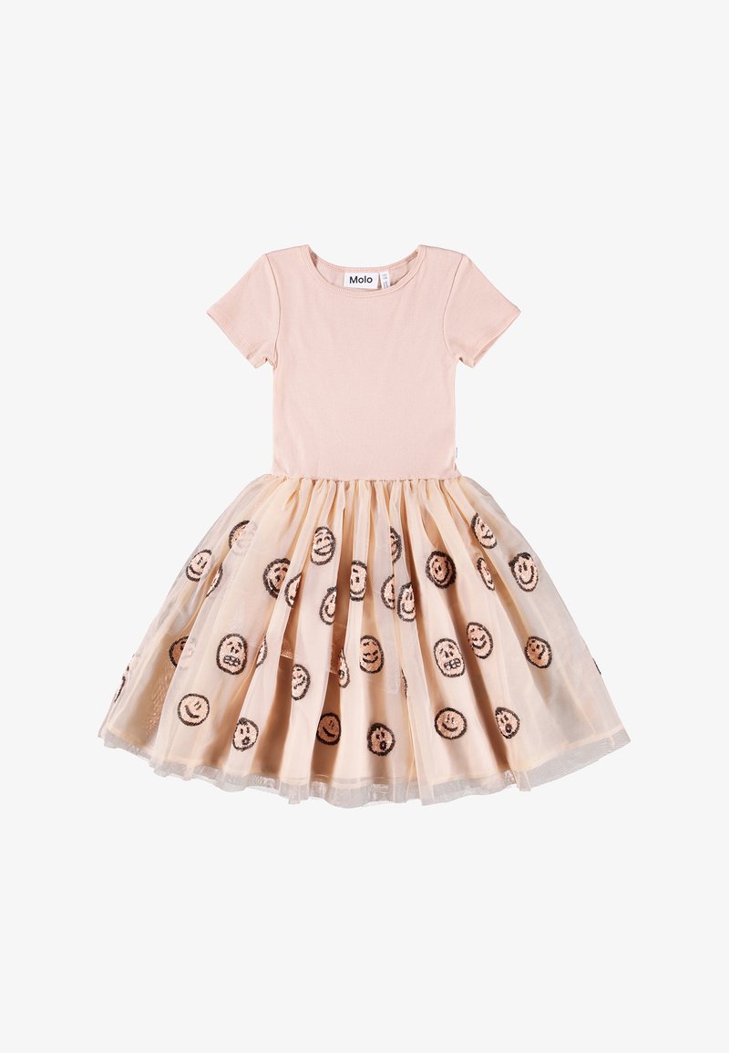 Top de algodão pêssego com mangas curtas e saia de tule, apresentando padrões de rostos sorridentes em preto sobre um fundo rosa claro.