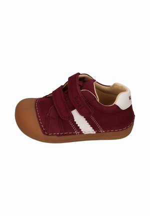 Maroon toddler shoe with brown rubber toe, double Velcro straps, white side stripe, beige interior, and brown sole, viewed from the outer side.