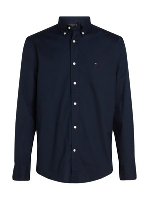 Navy blue button-down shirt made of cotton with a classic collar, long sleeves, and white buttons. Features a small logo on the chest.