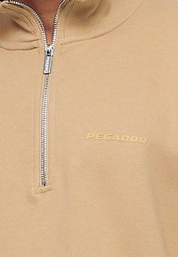 Pegador Felpa - cognac