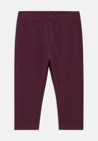 Leggings morados lisos para niños con cinturilla elástica, exhibidos sobre un fondo blanco.