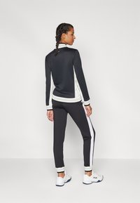 Fila PANTS RUMI Pantaloni sportivi black/white alyssum/nero