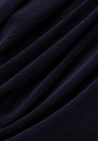 Navy blue, ribbed fabric with distinct horizontal lines, displaying soft texture and layered folds. Suitable for clothing or upholstery.