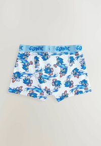 Blaue Baumwoll-Boxershorts mit einem sich wiederholenden Sonic the Hedgehog-Motiv mit Flammen, einem blauen Bund mit der Aufschrift "SONIC" und einer weichen Textur.