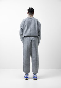 Nike Sportswear Träningsbyxor - grey