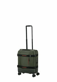 Rolling luggage in dark green fabric with black accents. Features a retractable handle, multiple wheels, and an external zip pocket.