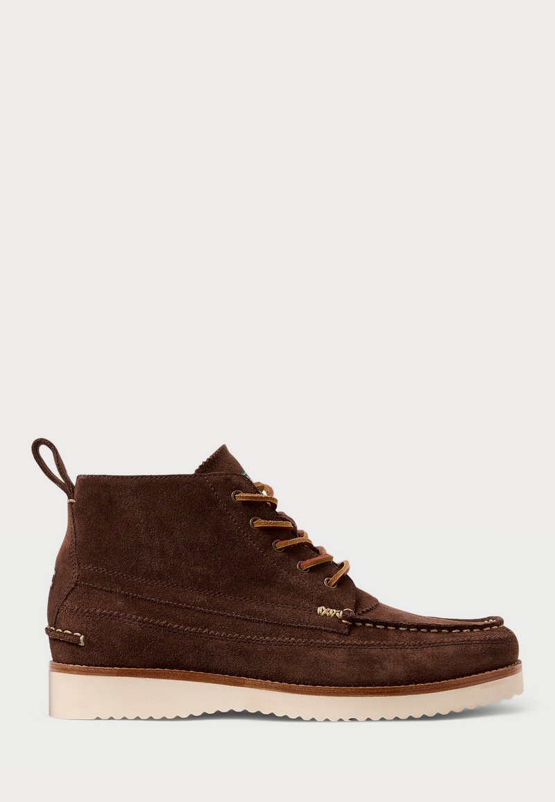 Brown suede ankle boots with a soft texture, featuring olive green accents, gold hardware, and a light rubber sole. Rounded toe design.