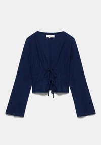 Blouse bleu marine à manches longues avec deux liens à l'avant et une taille légèrement froncée, en tissu léger texturé.