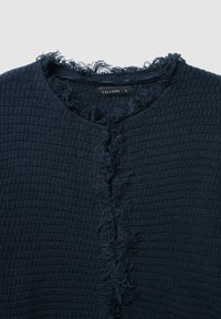 Navy blue textured cardigan with a frayed neckline, featuring a button closure and a woven pattern. Brand label "CALLIOPE" visible inside.